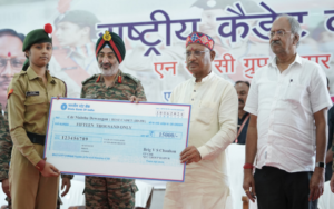 a group of men holding a large check